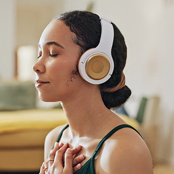 Woman, meditation and yoga in headphones listening to calm music